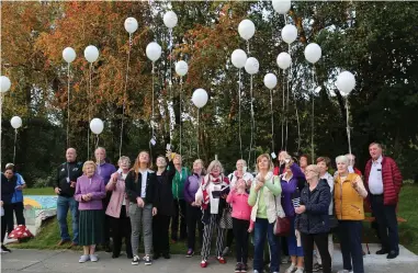  ??  ?? Balloons with the message ‘Always loved and never forgotten’ were released following the planting.