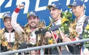  ?? AFP ?? Toyoto drivers, from right, Kazuki Nakajima, Sebastien Buemi and Fernando Alonso, celebrate on the podium.