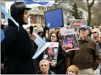  ?? CHRIS CHRISTO — BOSTON HERALD ?? Mayor Ruthanne Fuller speaks to people gathered to dedicate the rebuilt vandalized hostage memorial wall in front of a home on Homer Street.