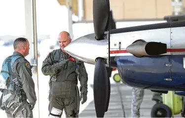  ?? Photos by Tom Reel / Staff photograph­er ?? A plane’s exterior is inspected as crews prepare to fly the troubled T-6A aircraft, about which pilots have reported 39 physiologi­cal episodes, at Joint Base San Antonio-Randolph in March.