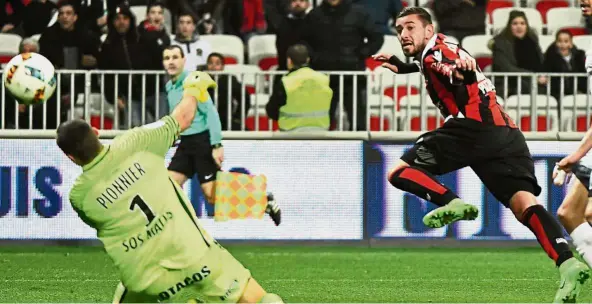  ??  ?? Neat finish: Nice forward Mickael Le Bihan scores during the Ligue 1 match against Montpellie­r on Friday. — AFP