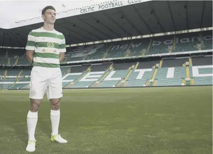  ??  ?? 2 Kieran Tierney dons Celtic’s new strip for next season at Celtic Park yesterday. The strip goes on sale in official Celtic stores and online today.