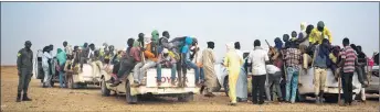  ?? AP PHOTO ?? Nigeriens and third-country migrants head towards Libya from Agadez, Niger on Monday. Migrants from across subSaharan African, Mali, the Gambia, Guinea, Ivory Coast, Niger and more are part of the mass migration toward Europe, some fleeing violence,...