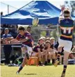  ??  ?? KICKING ON: Michael van Rooyen kicks for Downlands last Saturday.