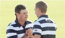  ?? SAM GREENWOOD, GETTY IMAGES ?? Patrick Reed, left, and Jordan Spieth won their match.