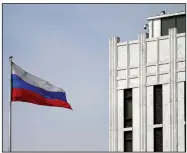  ?? (AP/Carolyn Kaster) ?? The Russian flag flies Thursday on the grounds of the Russian Embassy in Washington. After the U.S. imposed sanctions Thursday, Russian officials vowed a swift series of retaliator­y measures.