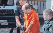  ?? ANDREW VAUGHAN THE CANADIAN PRESS ?? Matthew Vincent Raymond, charged with four counts of first degree murder, is taken from provincial court in Fredericto­n on Monday.