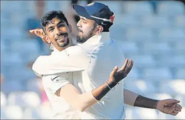  ?? AFP ?? Jasprit Bumrah (left) celebrates with KL Rahul after dismissing Jos Buttler for 106 on the fourth day of the third Test against England in Nottingham on Tuesday. Bumrah claimed five wickets to leave India a wicket away from victory.