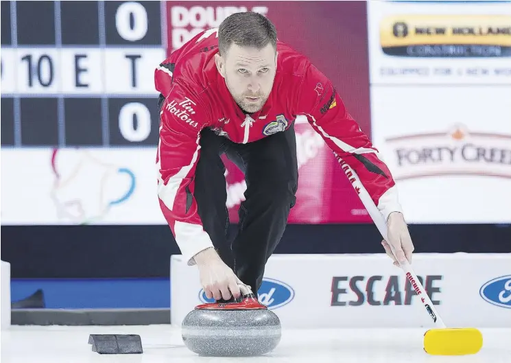  ?? ANDREW VAUGHAN/THE CANADIAN PRESS ?? Team Canada skip Brad Gushue prepares to deliver a rock against Alberta in the Brier championsh­ip game on Sunday in Regina.