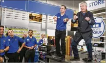  ?? BRUCE KLUCKHOHN / ASSOCIATED PRESS 2015 ?? Best Buy CEO Hubert Joly (right) leads a cheer for employees before the store opens on Thanksgivi­ng, in Minnetonka, Minn., in 2015. Joly, 59, is stepping aside in June.