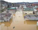  ??  ?? The Ohio River floods Aurora, Ind. More rain is expected in many parts of the country. USA TODAY NETWORK