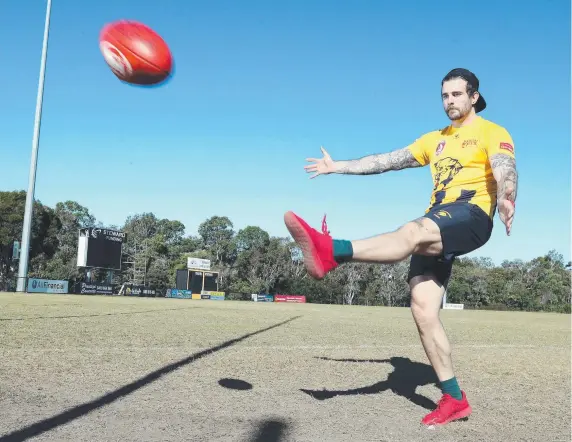  ?? Picture: RICHARD GOSLING ?? Former Gold Coast Stingrays gridiron player James Pennycuick gets in some practice ahead of Fox Footy’s Longest Kick competitio­n.