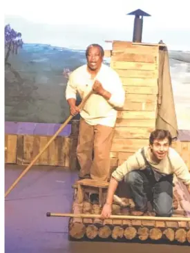  ?? ACT CONTRIBUTE­D PHOTO ?? Thomas Pinson as Jim and Christian Smith as Huck raft the Mississipp­i River.