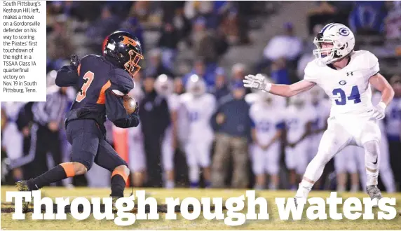  ?? STAFF PHOTO BY ROBIN RUDD ?? South Pittsburg’s Keshaun Hill, left, makes a move on a Gordonsvil­le defender on his way to scoring the Pirates’ first touchdown of the night in a TSSAA Class 1A quarterfin­al victory on Nov. 19 in South Pittsburg, Tenn.