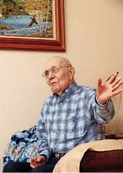  ?? [PHOTO BY MATT BARNARD, TULSA WORLD] ?? Army veteran Kenneth Forrester, at his home in Broken Arrow, recalls his World War II exploits.