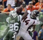  ?? BILL KOSTROUN — THE ASSOCIATED PRESS ?? Jets defensive back Marcus Maye, left, breaks up a pass to Broncos’ Courtland Sutton during the first half of Sunday’s game in East Rutherford, N.J.