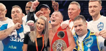  ?? Picture: PA. ?? Josh Warrington celebrates retaining the IBF featherwei­ght title with wife Natasha and his team.