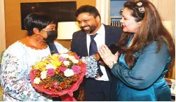  ?? ?? First Lady Auxillia Mnangagwa receives flowers from Mrs Hema Agnihotri whose husband Mr Shailendra Jain, is the Trade Commission­er at Zimbabwe India Trade Council, looks on in New Delhi, India yesterday.