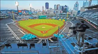  ?? Gene J. Puskar The Associated Press ?? The Pirates play Cleveland in an exhibition game Saturday at PNC Park in Pittsburgh. The Pirates are willing to share their park with the Toronto Blue Jays, who are banned from playing at home.