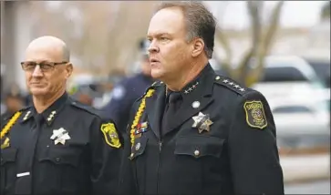  ?? Stephen Lam Getty Images ?? STANISLAUS COUNTY Sheriff Adam Christians­on, right, is among the critics of California’s “sanctuary state” law. Last month, a man in the country illegally fatally shot a police officer, Ronil Singh, in his county.