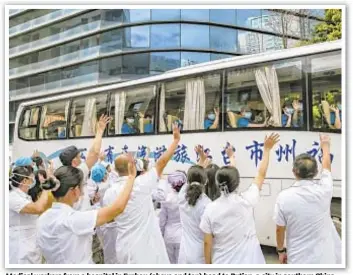  ??  ?? Medical workers from a hospital in Fuzhou (above and top) head to Putian, a city in southern China, to help with an outbreak of COVID-19. China declared the coronaviru­s under control in early 2020, but sporadic outbreaks have been occurring since the onset of the delta variant, officials suspect.