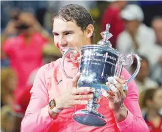  ??  ?? Spain’s Rafael Nadal poses with his winning trophy after defeating South Africa’s Kevin Anderson during their 2017 US Open Men’s Singles final match at the USTA Billie Jean King National Tennis Center in New York on September 10, 2017. Rafael Nadal...