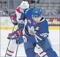  ?? TORONTO MARLIES PHOTO ?? LEFT: St. John’s native Colin Greening (38), shown in action with the AHL’S Toronto Marlies against the St. John’s Icecaps last season, is in line to become an unrestrict­ed free agent contract with the expiration a three-year deal he signed with the...