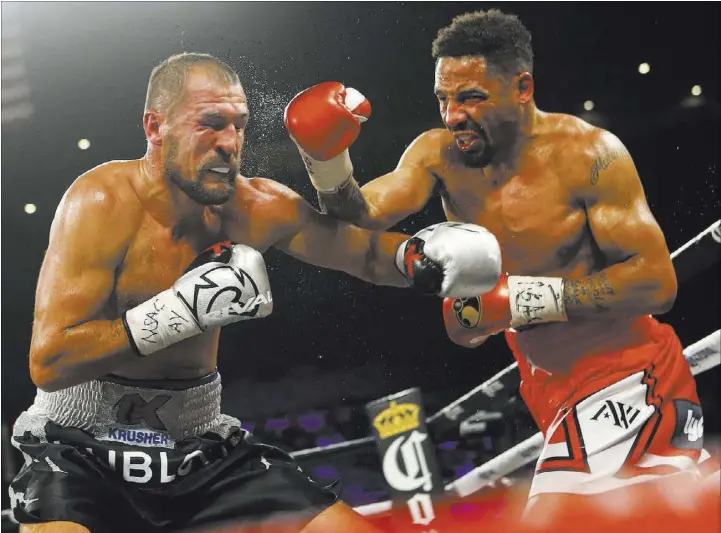  ?? Chase Stevens Las Vegas Review-Journal @csstevensp­hoto ?? Andre Ward, right, follows through on a rocking right hand to the head of Sergey Kovalev during their light heavyweigh­t championsh­ip title fight Saturday at Mandalay Bay Events Center. Ward successful­ly defended his three belts with a technical...