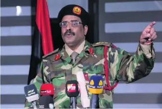  ?? Esam Omran Al Fetori / Reuters ?? Colonel Ahmed Al Mismari presented documents and videos which, he claimed, demonstrat­ed that Qatari forces had been meddling in Libyan affairs.