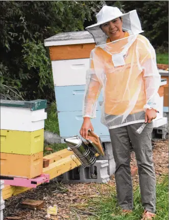  ??  ?? Dr. Hongmei Li-Byarlay is shown within the growing CSU Bee Research Laboratory within the bee yard in Wilberforc­e.