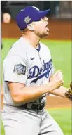  ?? Photograph­s by Wally Skalij Los Angeles Times ?? TREINEN looks on after recording the last out. It was his f irst career postseason save.