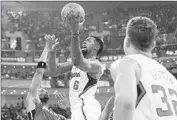  ?? Andy Wong Associated Press ?? DeANDRE JORDAN, center, Blake Griffin, right, and the Clippers are playing two games in China.