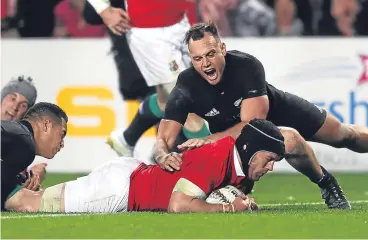  ??  ?? Sean O’Brien crosses the All Blacks line for a sensationa­l Lions try.