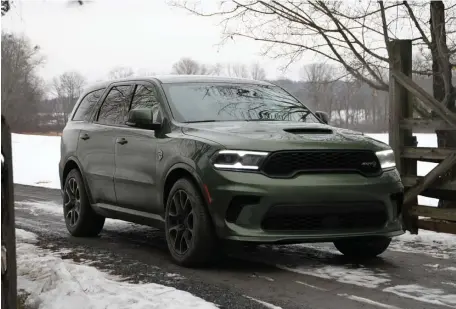  ?? MARC GRASSO PHOTOS / BOSTON HERALD ?? POWERFUL PERFORMER: The Dodge Durango SRT with the Hellcat motor and powertrain is a one-of-a-kind familymove­r with some real get-up-and-go, and a 6.2-liter V8 engine that does zero-to-60 in 3.5 seconds.