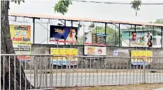  ??  ?? The wall surroundin­g the De Zoyza Stadium has become a free advertisin­g space for all manner of tuition masters