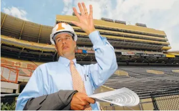  ?? PHOTO BY CLAY OWEN/NEWS SENTINEL ?? John Currie, then-University of Tennessee senior associate athletic director, helps lead a media tour of Neyland Stadium after its renovation. Currie, who spent the last eight years as athletic director at Kansas State, was hired Tuesday to replace...