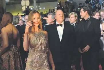  ?? Loic Venance Getty Images ?? GEORGINA CHAPMAN and her husband, Harvey Weinstein, arrive at the Cannes Film Festival in 2016.