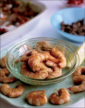  ?? St. Louis Post- Dispatch/ TNS/ CRISTINA M. FLETES ?? Spiced Shrimp is sure to impress potluck diners.