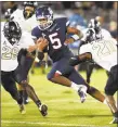  ?? Stephen Dunn / Associated Press ?? UConn quarterbac­k David Pindell (5) runs the ball in for a touchdown against Central Florida during their season opener.