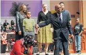  ?? Staff photo by Michael Minasi ?? Kirbyjon Caldwell, senior pastor of Windsor Village United Methodist Church, uses volunteers to drive home points of his tribute during the Martin Luther King, Jr. Day celebratio­n on Monday, Jan. 15, 2018, at The Woodlands United Methodist Church.