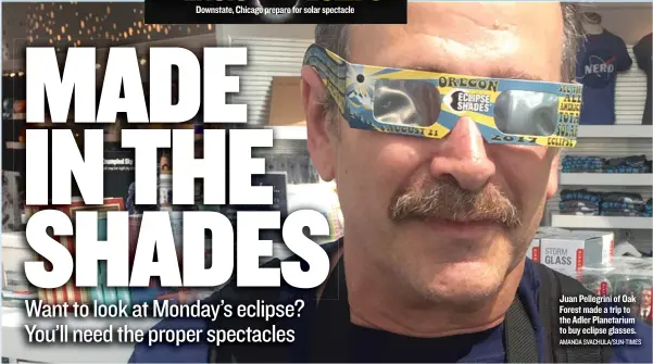  ?? AMANDA SVACHULA/ SUN- TIMES ?? Juan Pellegrini of Oak Forest made a trip to the Adler Planetariu­m to buy eclipse glasses.