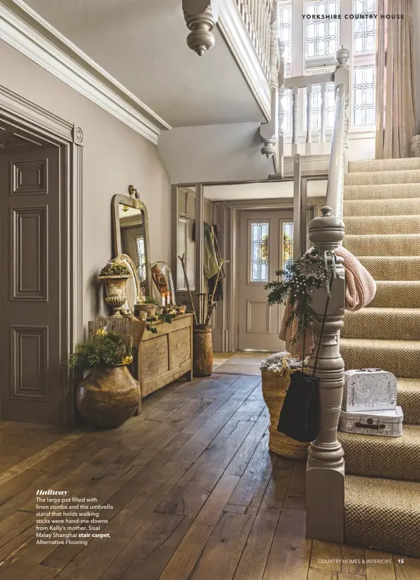  ??  ?? Hallway
The large pot filled with linen combs and the umbrella stand that holds walking sticks were hand-me-downs from Kelly’s mother. Sisal Malay Shanghai stair carpet,
Alternativ­e Flooring