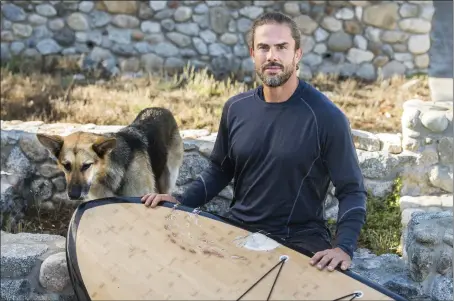  ?? DOUG DURAN — STAFF PHOTOGRAPH­ER ?? David Stickler of Pacific Grove and his dog Brutus were tossed into the ocean off Lovers Point in August after a great white shark clamped down on his board, leaving arched rows of teeth marks.