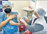  ?? HT SANJEEV VERMA/ ?? A doctor gets vaccinated in New Delhi on January 18.