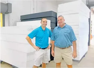  ?? MIKE STOCKER/STAFF PHOTOGRAPH­ER ?? Jason Harrison and his father, John Harrison, at their Pompano Beach-based company AccuDock.