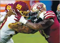  ?? ROSS D. FRANKLIN — THE ASSOCIATED PRESS, FILE ?? Washington Football Team defensive end Chase Young (99) and 49ers offensive tackle Trent Williams battle during the first half on Dec. 13 in Glendale, Ariz.