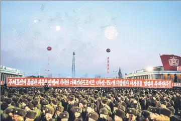  ??  ?? North Korean soldiers watch a fireworks display put on to celebrate the North’s declaratio­n it had achieved full nuclear statehood, during a mass rally on Kim Il-Sung Square in Pyongyang. — AFP photo