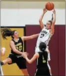  ?? PETE BANNAN — DIGITAL FIRST MEDIA ?? Nicole Massimino (13), shown grabbing a rebound earlier this season against Interboro, is one of six seniors who helped Radnor defeat Penn Wood, 72-57. Penn Wood’s Carle Andrews made six 3-pointers in scoring a game-high 34 points.