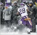  ?? NICK WASS/ THE ASSOCIATED PRESS ?? Ravens linebacker Arthur Brown injures Vikings running back Adrian Peterson with a tackle in the second quarter.