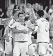  ?? JIM GENSHEIMER/STAFF ?? Games against L.A. hold extra meaning for the Earthquake­s’ Shea Salinas, celebratin­g a score against the Galaxy in 2015.